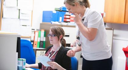 Twp physios at a computer