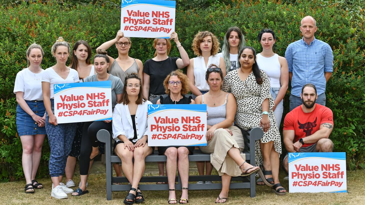 CSP workplace representatives holding placards calling for a fair pay rise for NHS staff