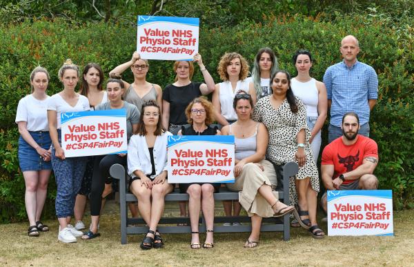 CSP workplace representatives holding placards calling for a fair pay rise for NHS staff