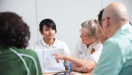 Physiotherapists taking part in a discussion with health professionals